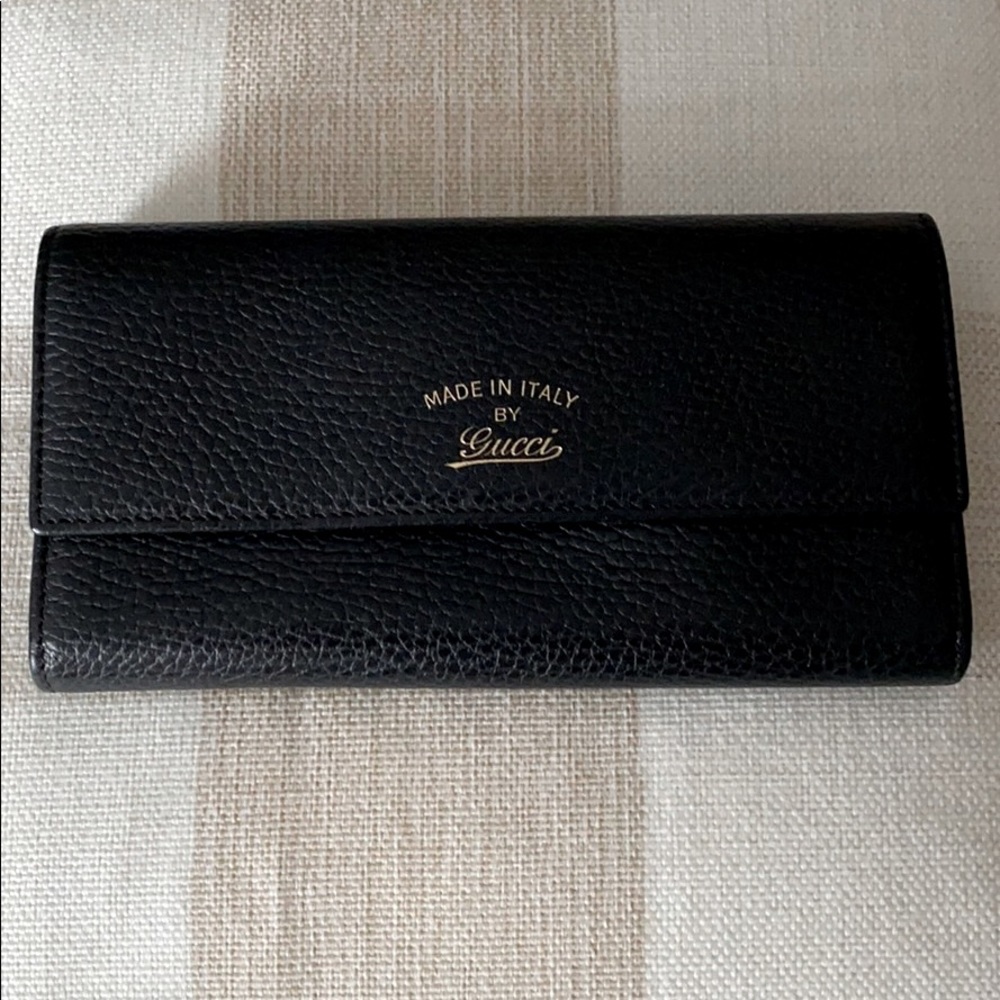 Black Gucci made in Italy dollar calf wallet